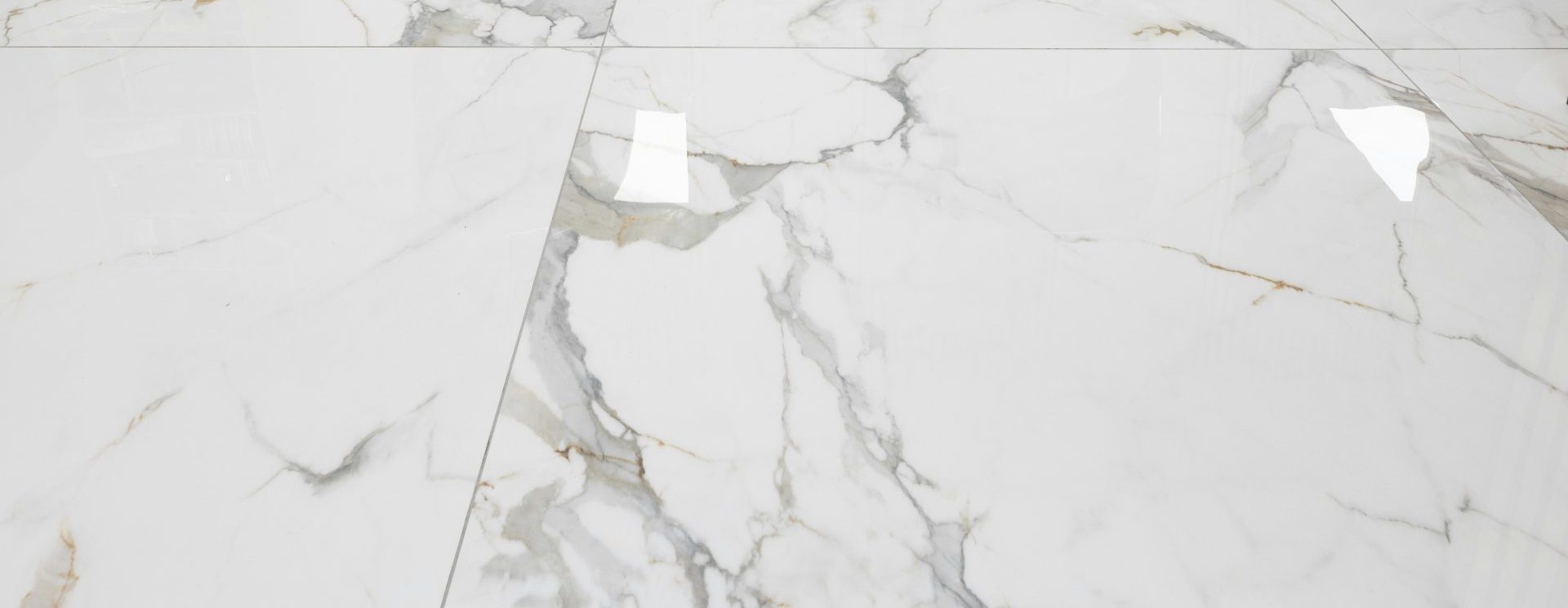 three chairs sitting on a marble floor in a room